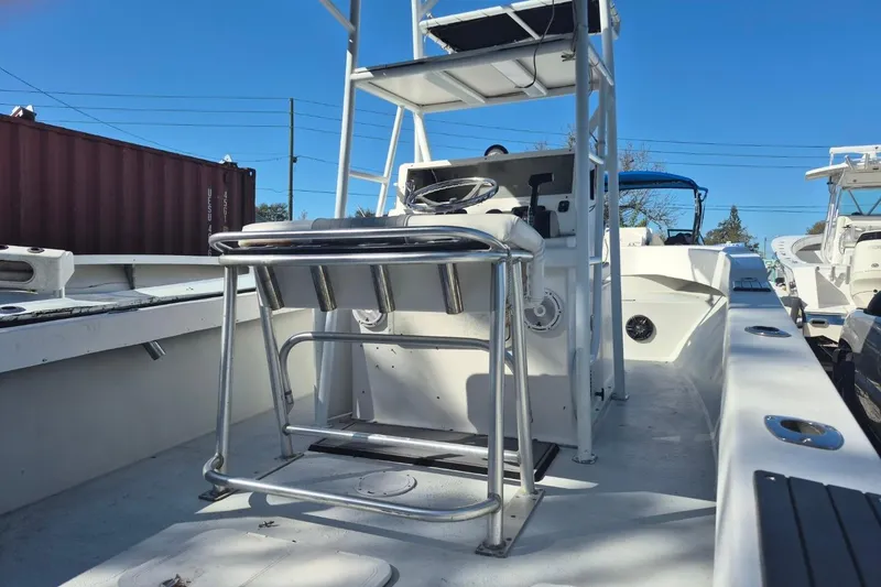 Slide: The Image of 1993 Dusky 227 Open Fisherman boat interior with steering console and seating. - 6