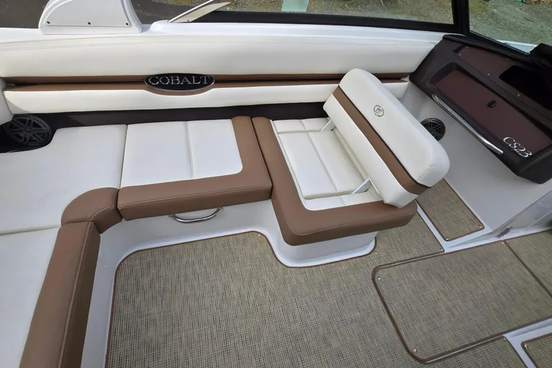 Slide: The Image of Interior of 2018 Cobalt CS23 boat with brown and white seating. - 19