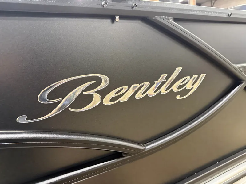 Slide: The Image of Close-up of Bentley logo on 2026 Legacy 220 QSB pontoon boat. - 39