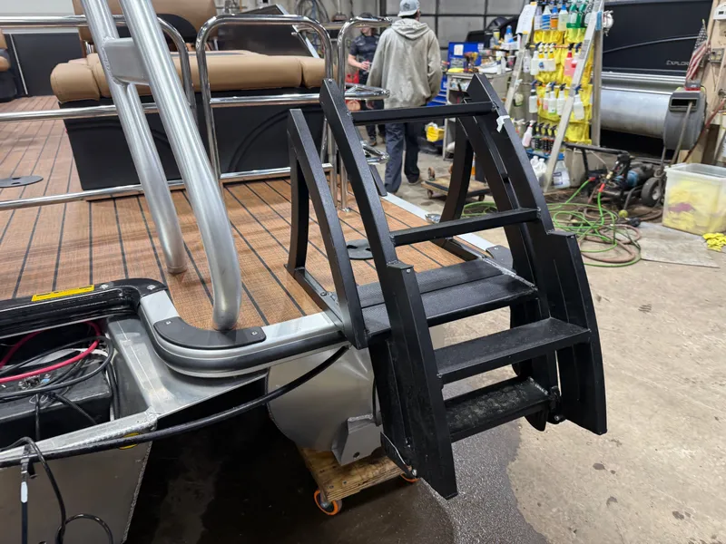 Slide: The Image of 2026 Bentley Pontoons Legacy 220 QSB with black ladder and wood deck. - 43