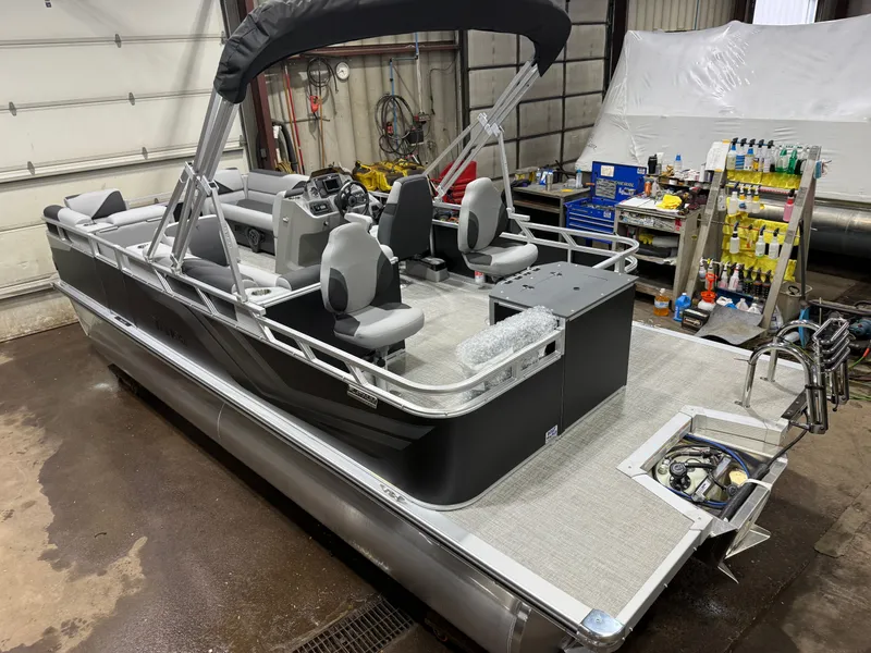 The Image of 2026 Tahoe Sport Rear Fish 2180 pontoon boat in workshop. - 1