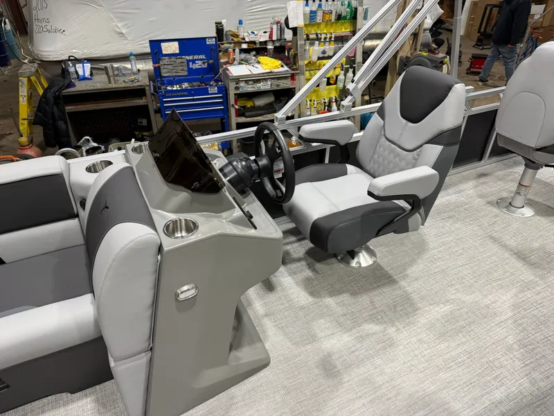 Slide: The Image of Interior of a 2026 Tahoe Sport Rear Fish 2180 boat with helm console. - 10