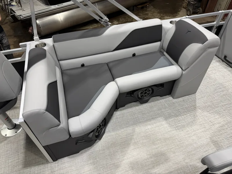 Slide: The Image of 2026 Tahoe Sport boat interior with gray upholstery. - 18