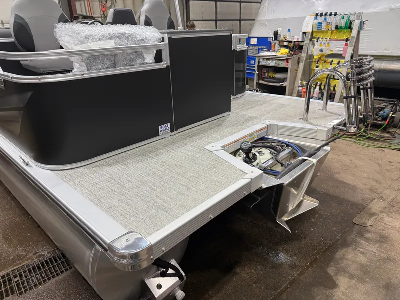 Slide: The Image of 2026 Tahoe Sport Rear Fish 2180 boat in factory, engine area visible. - 38