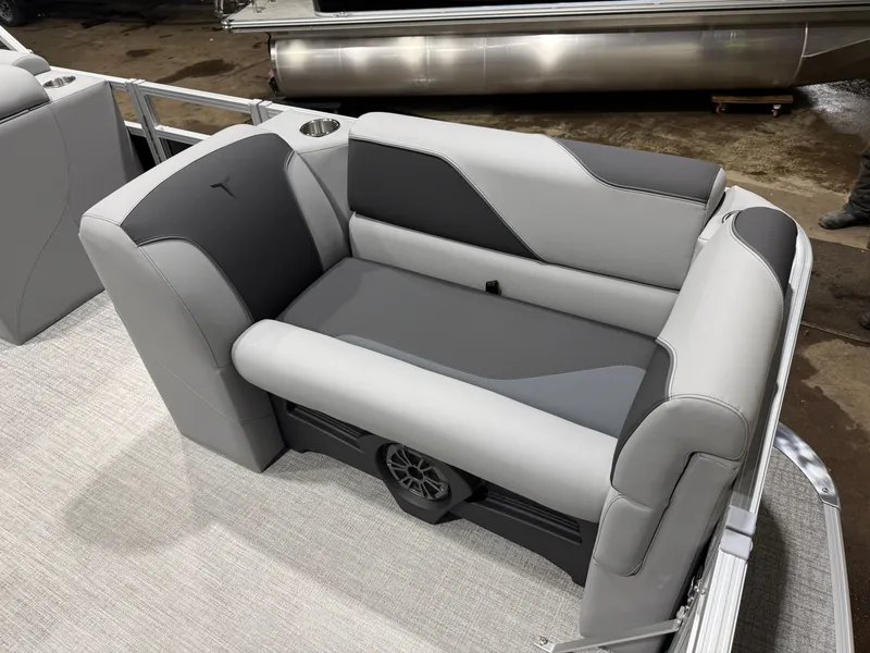 Slide: The Image of 2026 Tahoe Sport boat seating area with gray upholstery. - 9