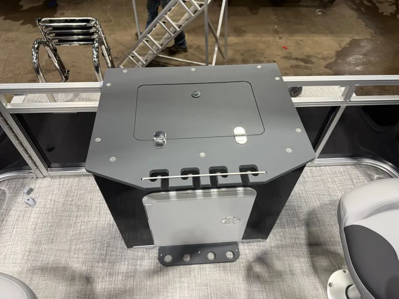 Slide: The Image of 2026 Tahoe Sport Quad Fish Pontoon interior with gray storage unit. - 20