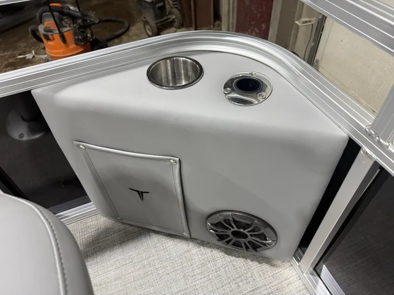 Slide: The Image of Interior of Tahoe Sport Quad Fish 1980 Pontoon 2026 with speaker and cup holder. - 28