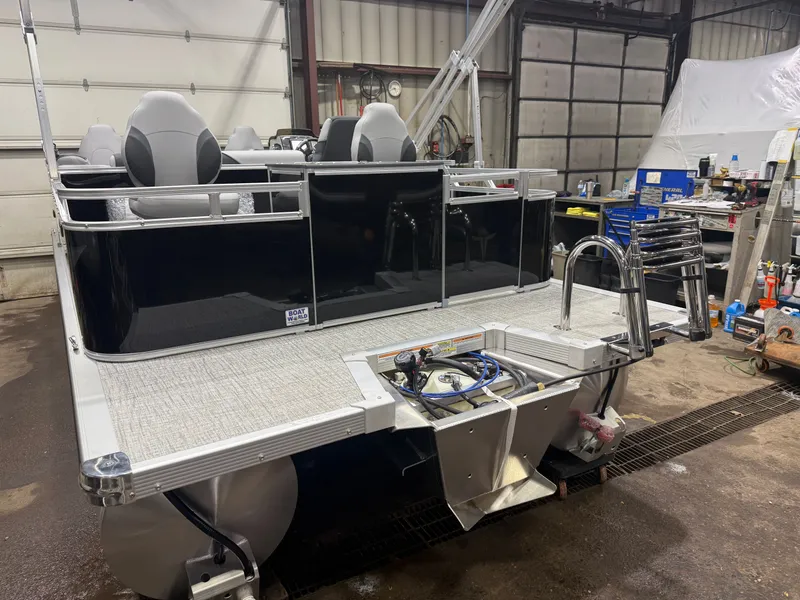 Slide: The Image of 2026 Tahoe Sport Quad Fish Pontoon in storage area. - 39