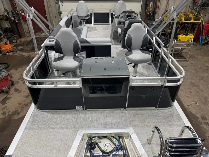 Slide: The Image of 2026 Tahoe Sport Quad Fish Pontoon interior, gray seating, priced at $30,995. - 6