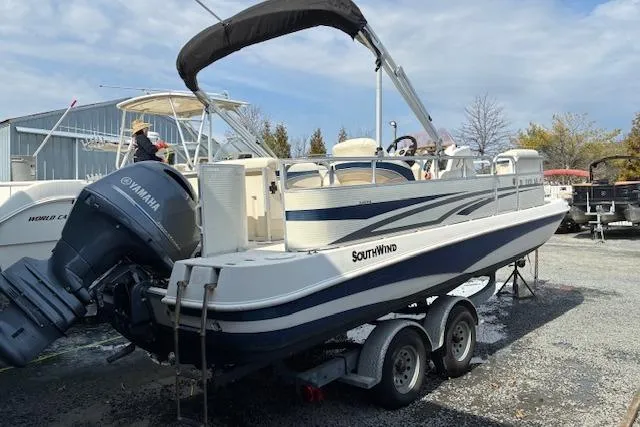 The Image of 2007 SouthWind 229 Deck Boat on trailer with Yamaha outboard motor, parked outdoors. - 0