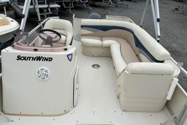 Slide: The Image of 2007 SouthWind 229 Deck Boat with spacious seating and steering console. - 3