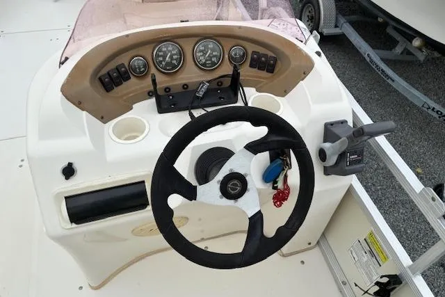 Slide: The Image of Steering console of a 2007 SouthWind 229 Deck Boat with gauges and controls. - 4