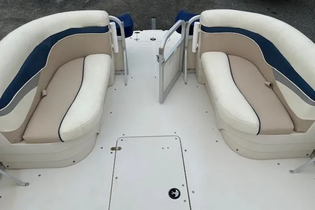 Slide: The Image of 2007 SouthWind 229 Deck Boat interior with beige and blue seating arrangement. - 5