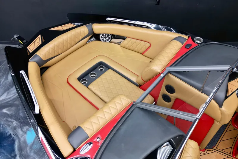 Slide: The Image of Luxurious interior of 2017 Tigé RZX2 boat with tan leather seating and cup holders. - 14