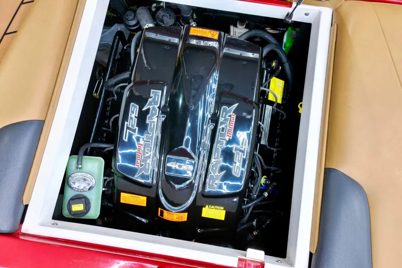 Slide: The Image of Engine compartment of a 2017 Tigé RZX2 boat featuring a Raptor 6.2L motor. - 16