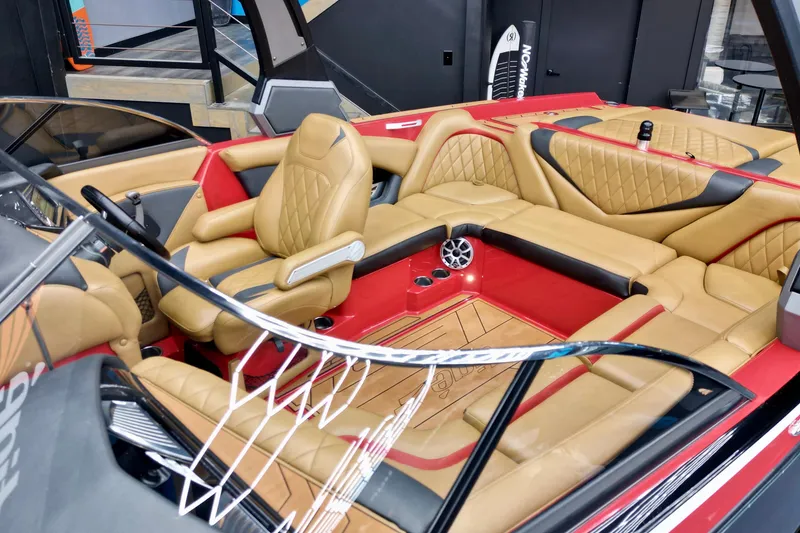 Slide: The Image of 2017 Tigé RZX2 boat interior with luxurious tan leather seating and modern design. - 6