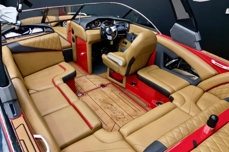 Slide: The Image of Luxurious interior of 2017 Tigé RZX2 boat with tan leather seating and modern dashboard. - 8