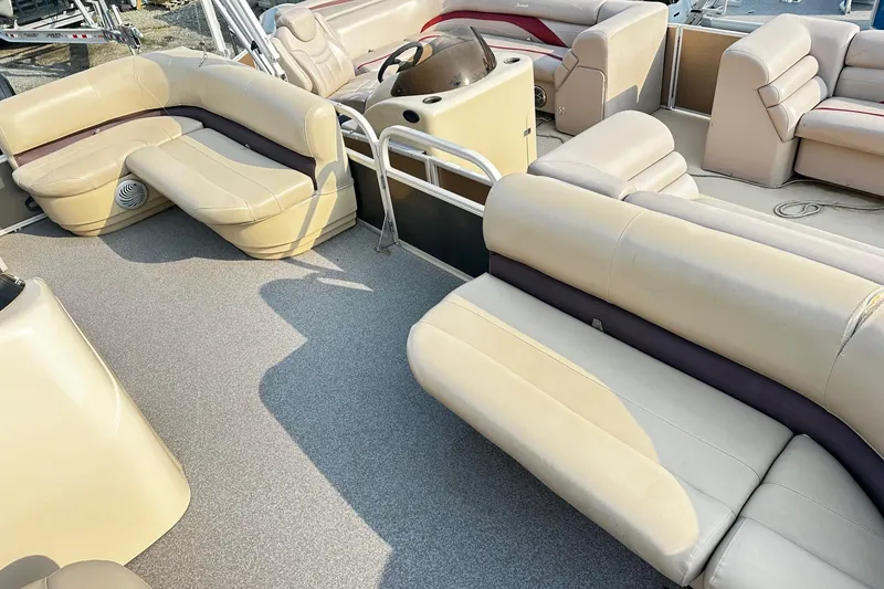 Slide: The Image of 2018 Sun Tracker Bass Buggy 18 Classic Series pontoon boat interior with beige seating. - 10