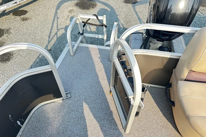Slide: The Image of 2018 Sun Tracker Bass Buggy 18 Classic Series pontoon boat interior with seating and railing. - 11
