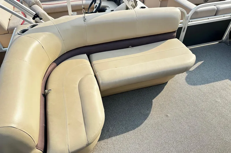 Slide: The Image of 2018 Sun Tracker Bass Buggy 18 Classic Series with beige seating and spacious deck. - 19