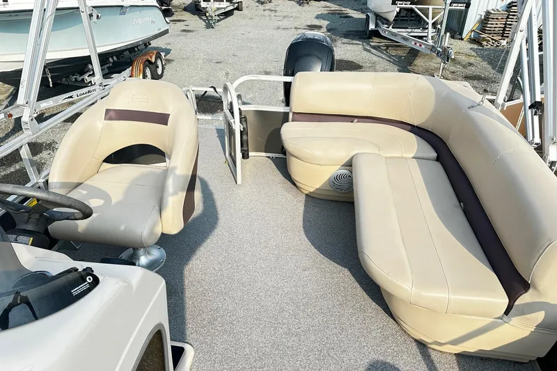 Slide: The Image of 2018 Sun Tracker Bass Buggy 18 Classic Series pontoon boat interior with beige seating. - 6