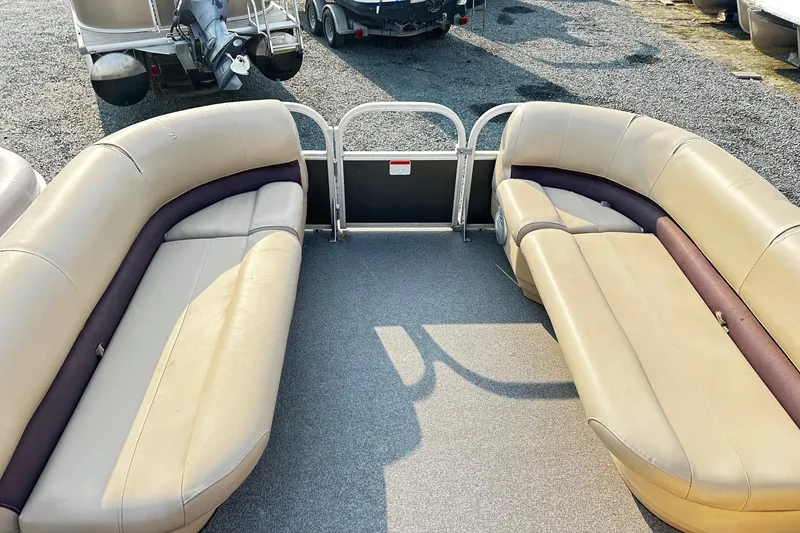 Slide: The Image of 2018 Sun Tracker Bass Buggy 18 Classic Series pontoon boat interior with beige seating. - 9