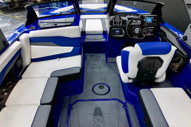 Slide: The Image of Luxurious interior of 2025 Axis T220 boat with modern seating and dashboard. - 10