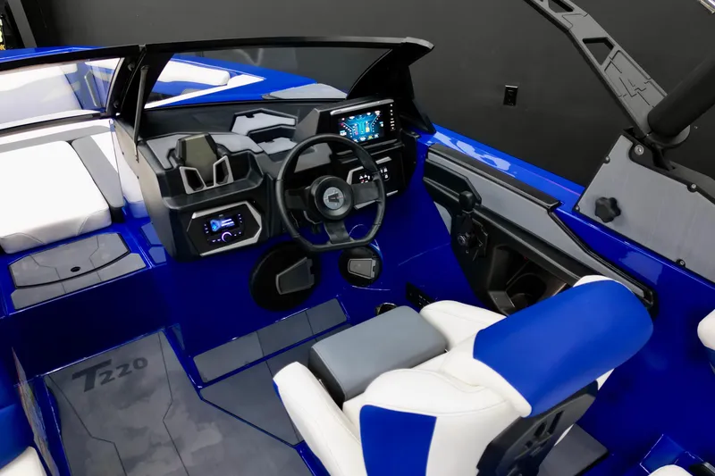 Slide: The Image of 2025 Axis T220 boat interior with modern dashboard and blue accents. - 11
