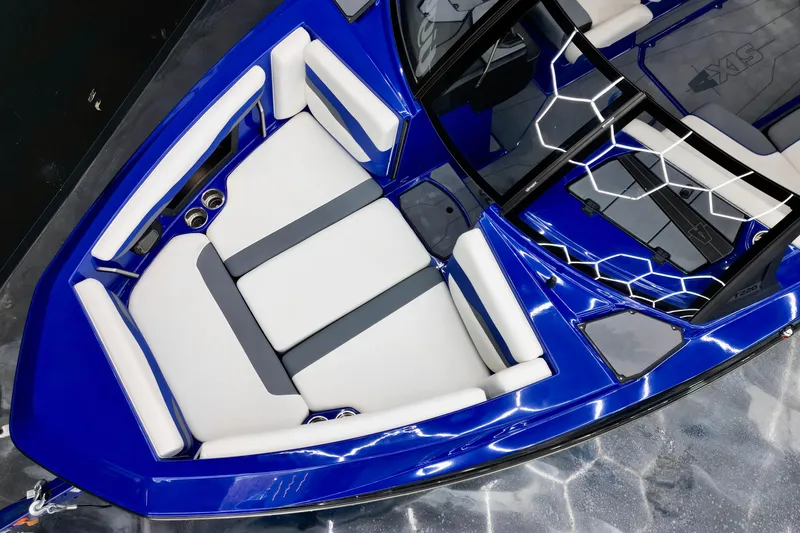 Slide: The Image of 2025 Axis T220 boat interior with blue and white seating, modern design. - 7