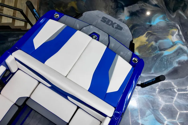 Slide: The Image of 2025 Axis T220 boat interior with blue and white seating, viewed from above. - 9