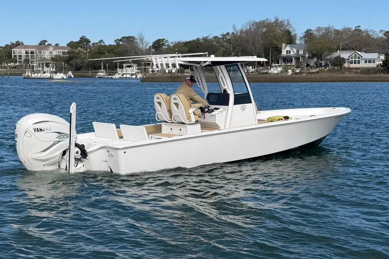 Slide: The Image of 2023 Sportsman Masters 267 Bay Boat cruising on calm waters. - 2