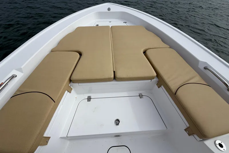 Slide: The Image of 2023 Sportsman Masters 267 Bay Boat with beige cushioned seating on deck. - 34