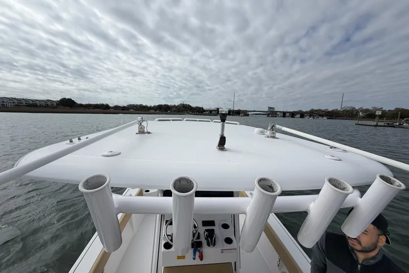 Slide: The Image of 2023 Sportsman Masters 267 Bay Boat on water under cloudy sky. - 40