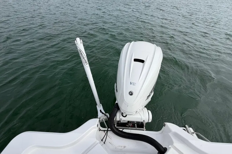 Slide: The Image of 2023 Sportsman Masters 267 Bay Boat with outboard motor on water. - 44