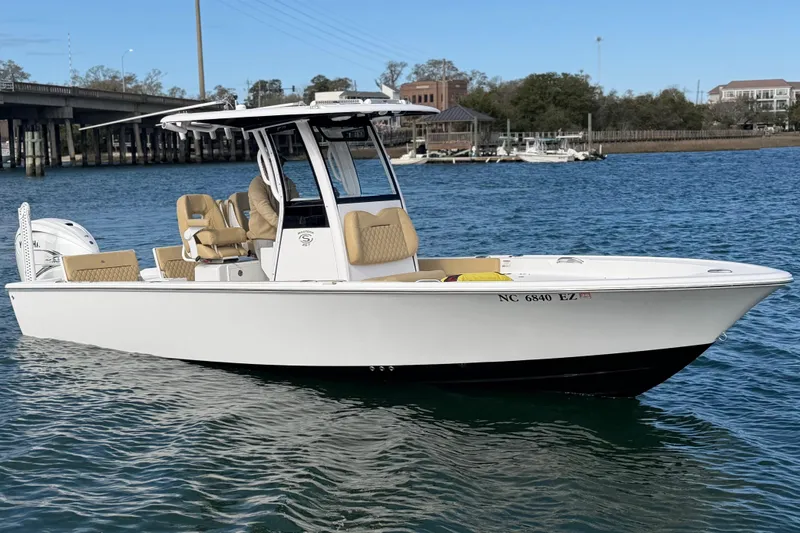 Slide: The Image of 2023 Sportsman Masters 267 Bay Boat on water, featuring sleek design and modern amenities. - 8