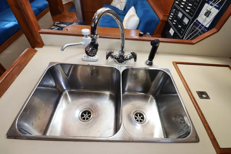 Slide: The Image of Stainless steel double sink in 1996 Island Packet 40 yacht galley. - 10