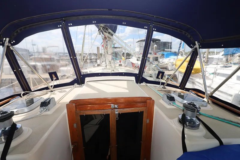Slide: The Image of Cockpit view of a 1996 Island Packet 40 sailboat in a marina. - 31