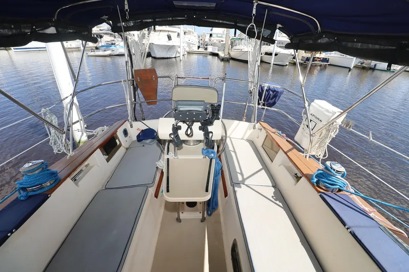 Slide: The Image of Cockpit view of a 1996 Island Packet 40 sailboat docked at a marina. - 33