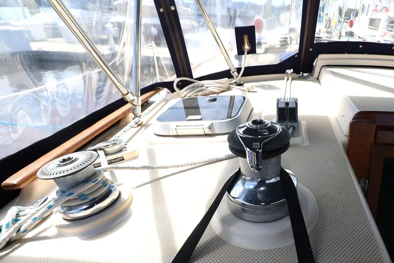 Slide: The Image of Cockpit of 1996 Island Packet 40 sailboat with winch and ropes. - 34