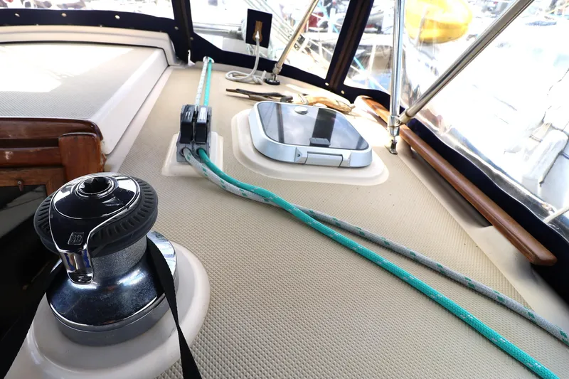 Slide: The Image of Interior view of a 1996 Island Packet 40 sailboat, featuring winch and ropes. - 35