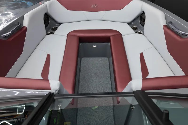 Slide: The Image of 2023 MasterCraft NXT24 boat interior with red and white seating. - 15