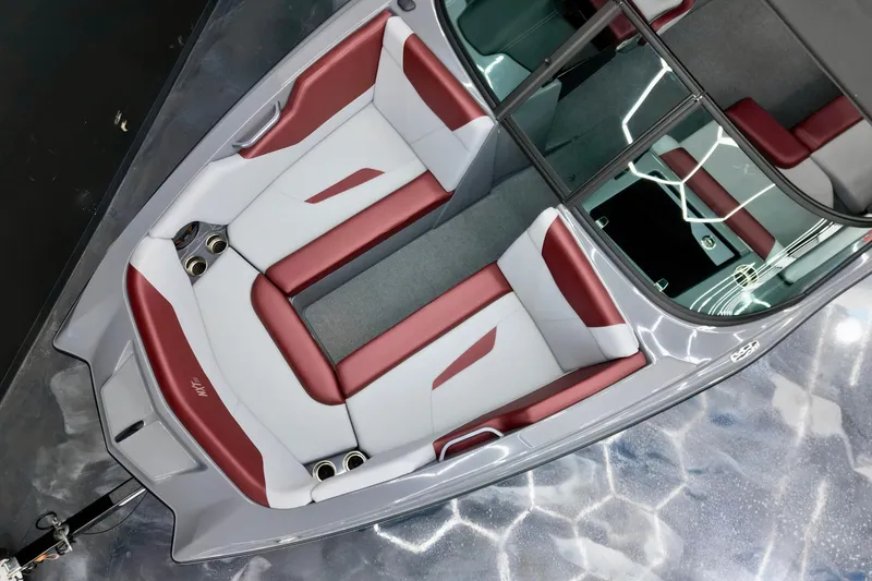 Slide: The Image of 2023 MasterCraft NXT24 boat interior with red and white seating, overhead view. - 5