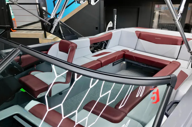 Slide: The Image of 2023 MasterCraft NXT24 boat interior with red and white seating, modern design. - 6