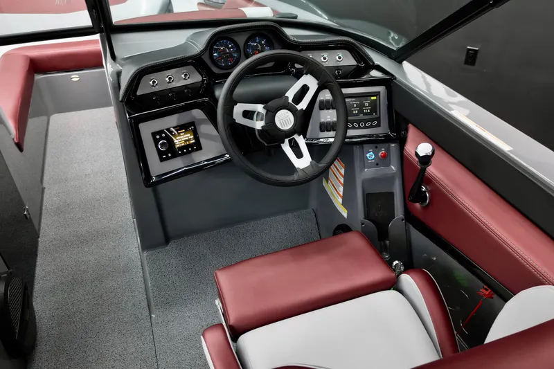 Slide: The Image of 2023 MasterCraft NXT24 boat interior with modern dashboard and steering wheel. - 8