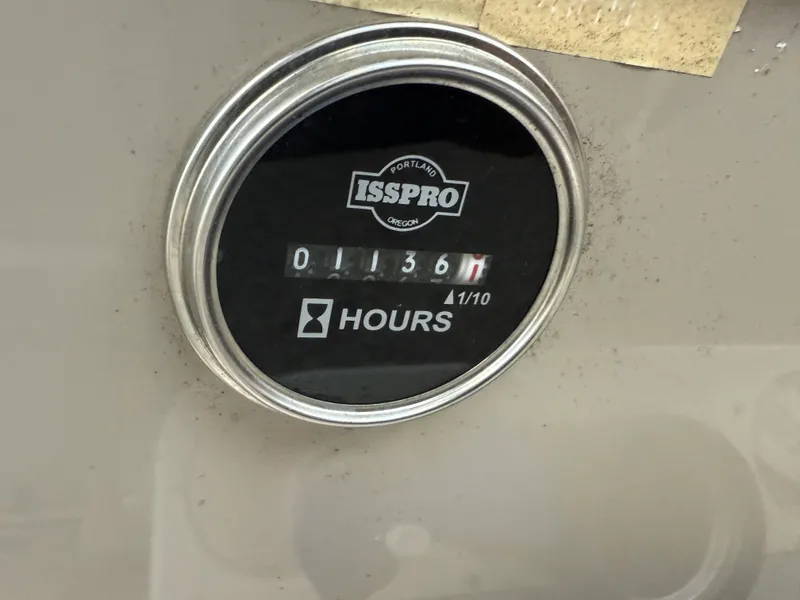 Slide: The Image of Hour meter on Rinker Fiesta Vee 270 boat, displaying 1136 hours. - 11