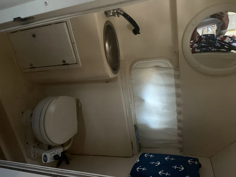 Slide: The Image of Interior of 2000 Rinker Fiesta Vee 270 yacht with toilet and sink. - 6