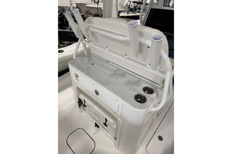 Slide: The Image of 2026 Tidewater 272 LXF boat console with rod holders and cup holders. - 2