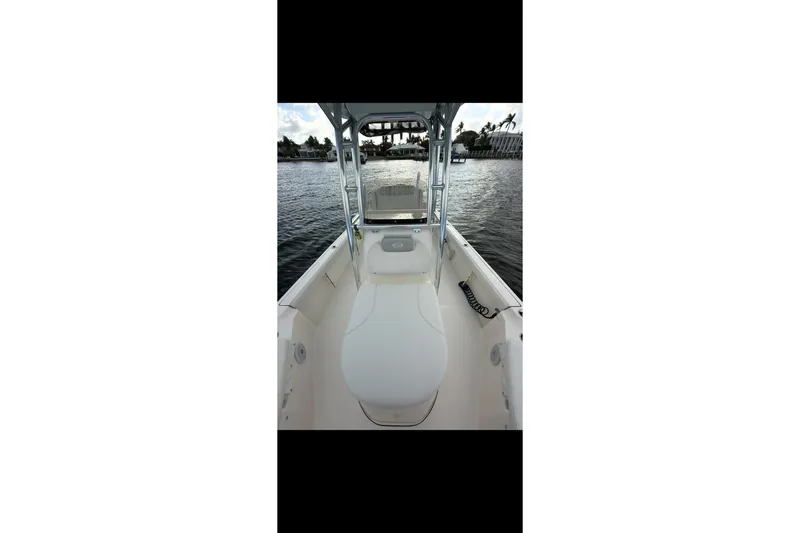 Slide: The Image of 2023 Key West 250 Bay Reef boat interior on calm water. - 13