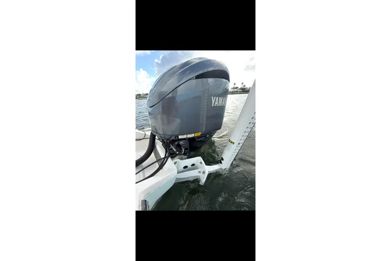 Slide: The Image of 2023 Key West 250 Bay Reef boat with Yamaha outboard motor on water. - 18
