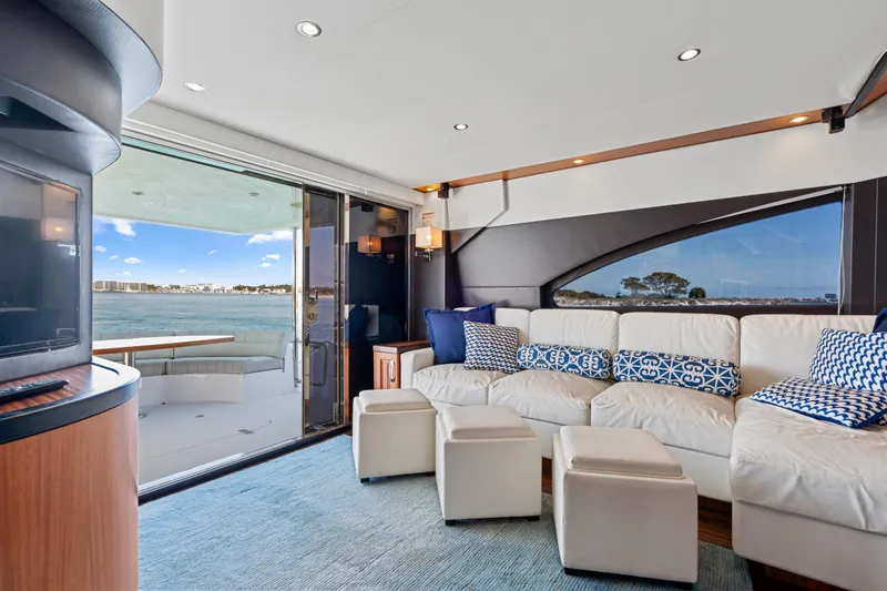 Slide: The Image of Luxurious interior of 2013 Hatteras 60 Motor Yacht with plush seating and ocean view. - 14